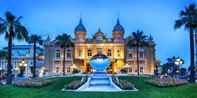 A large building with a fountain in front of it