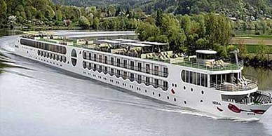 A large white boat floating on top of water.