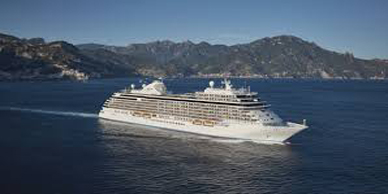 A large cruise ship sailing on the water.